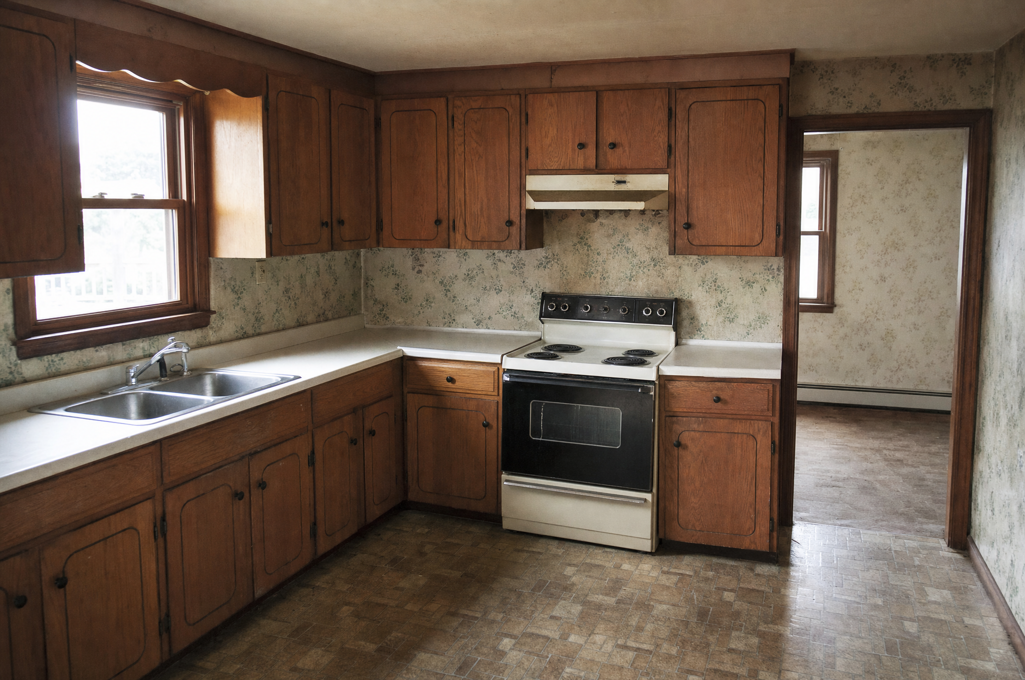 A dated, lived-in kitchen in an older home that has not been updated in years