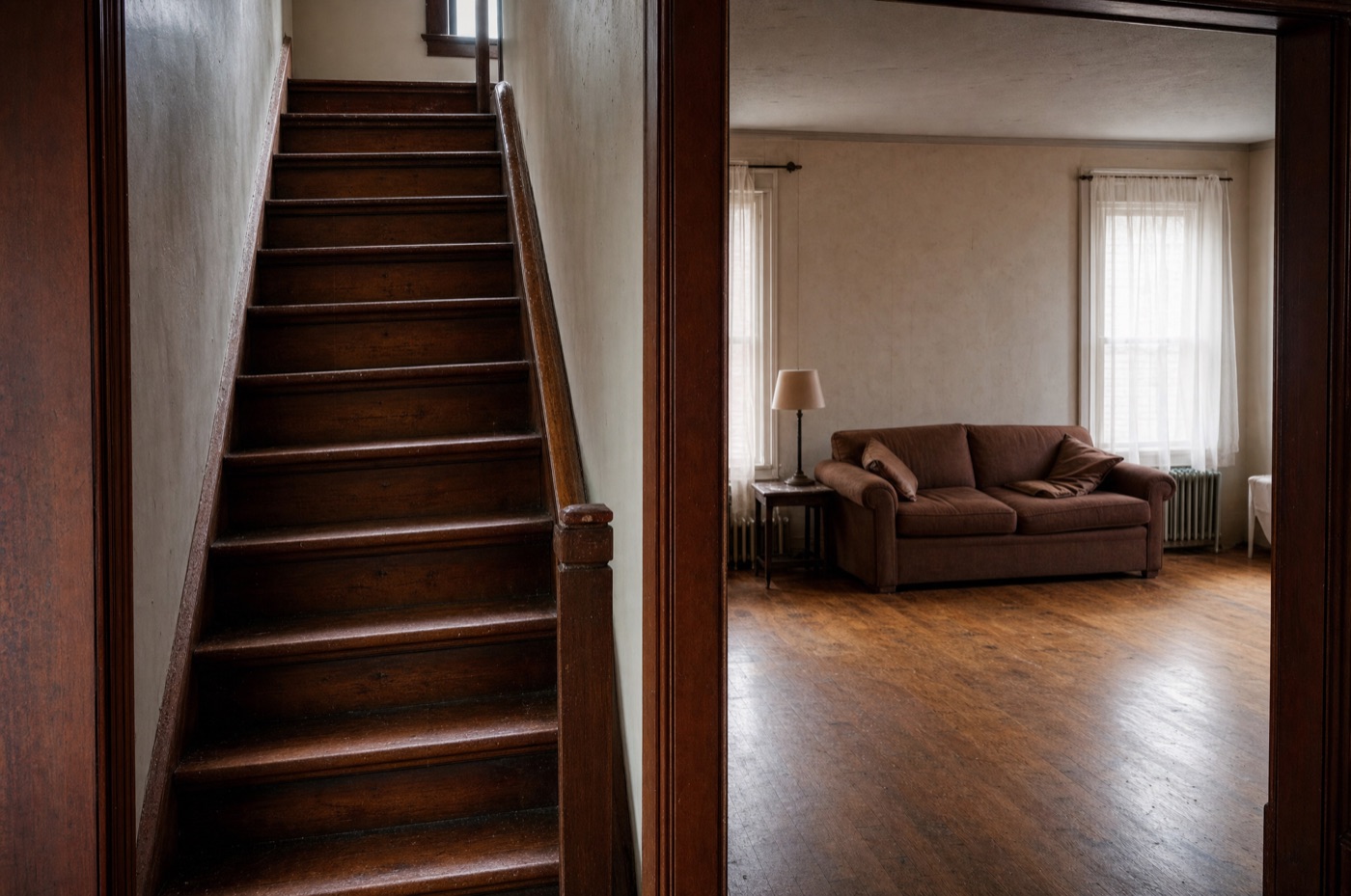 Still staircase and rooms in a longtime family home that now sit mostly empty