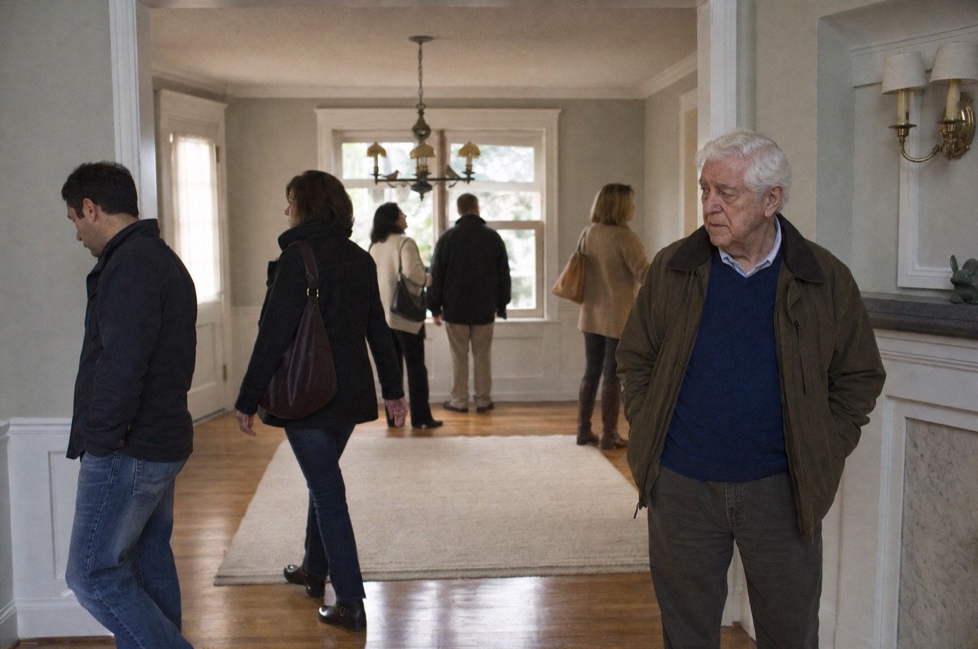 Unfamiliar visitors touring a home during an open house showing